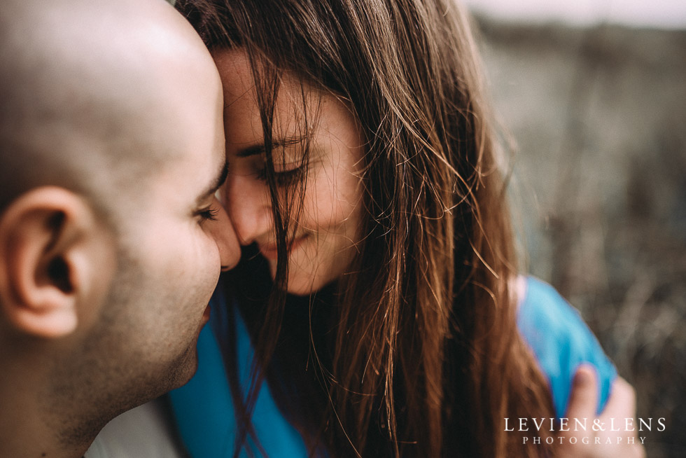 sweet moment - Muriwai Beach couples-engagement photo shoot {Auckland wedding photographer}