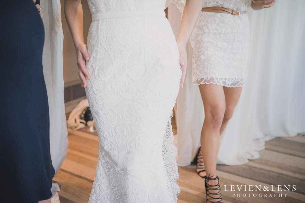 trying dress on - Bridal Show - High Tea by Trish Peng {Auckland wedding photographer} Sofitel Viaduct