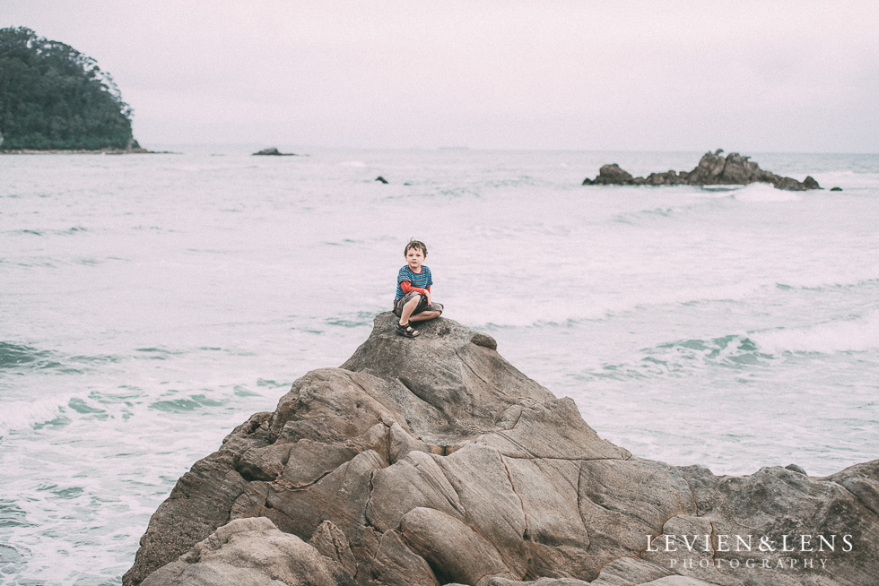 boy sitting on cliff - One little day in Tauranga - personal everyday moments {Hamilton NZ wedding photographer} 365 Project