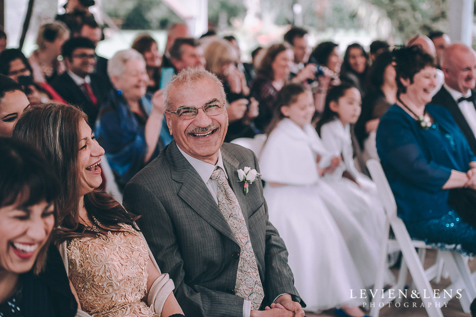 ceremony guests laughing - Markovina Vineyard Estate - Kumeu {Auckland wedding photographer}