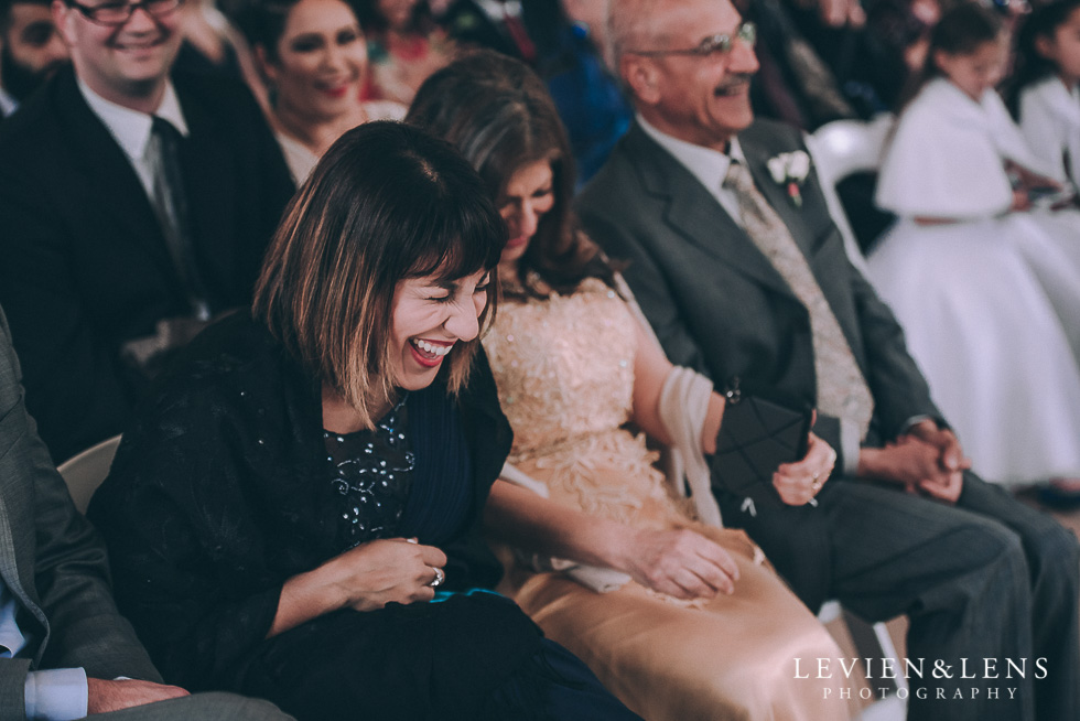 guests ceremony laughing - Markovina Vineyard Estate - Kumeu {Auckland wedding photographer}