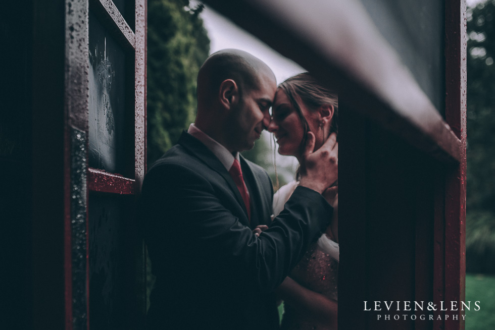 bride and groom in red phone box - Markovina Vineyard Estate - Kumeu {Auckland wedding photographer}