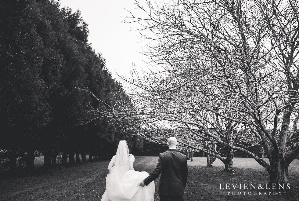 BW bride and groom walking - Markovina Vineyard Estate - Kumeu {Auckland wedding photographer}