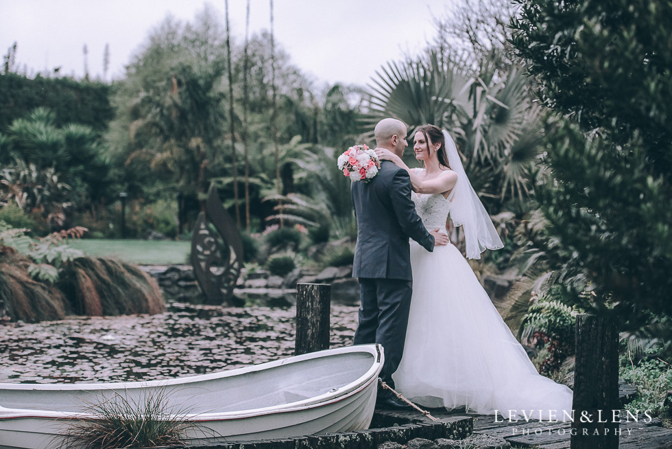 bride and groom near boat - Markovina Vineyard Estate - Kumeu {Auckland New Zealand wedding photographer}