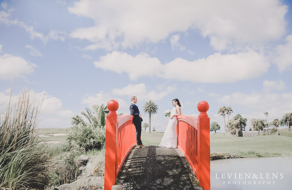couple on red bridge - Formosa wedding Golf Resort {Auckland weddings photographer}
