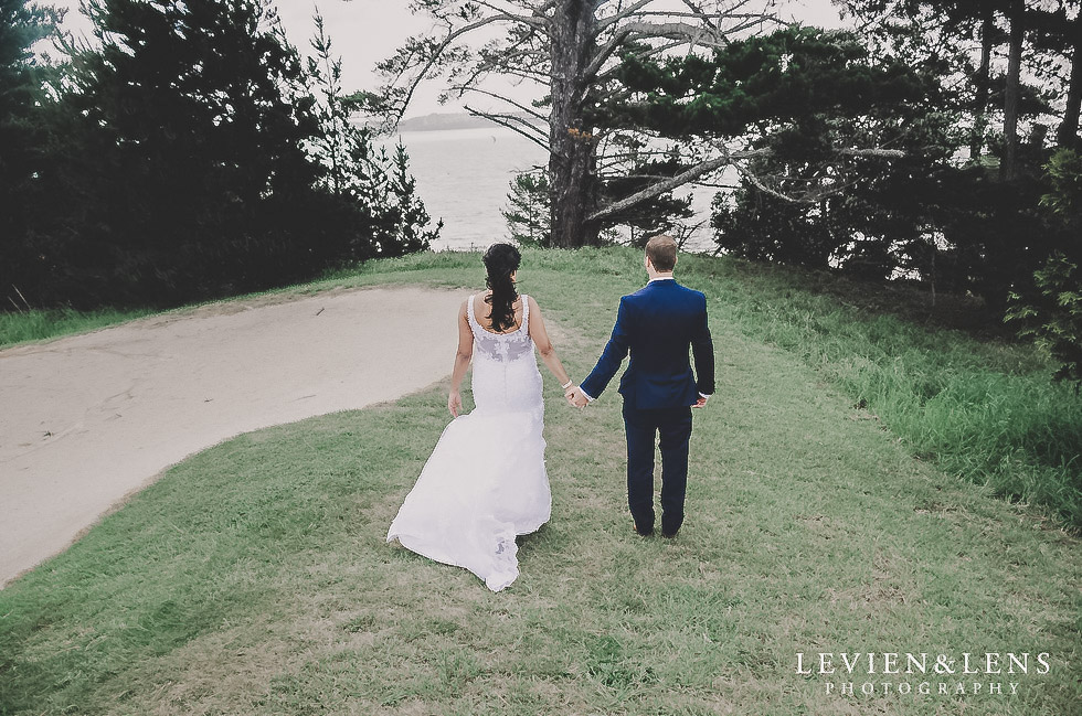 couple walking holding hands - Formosa wedding Golf Resort {Auckland weddings photographer}