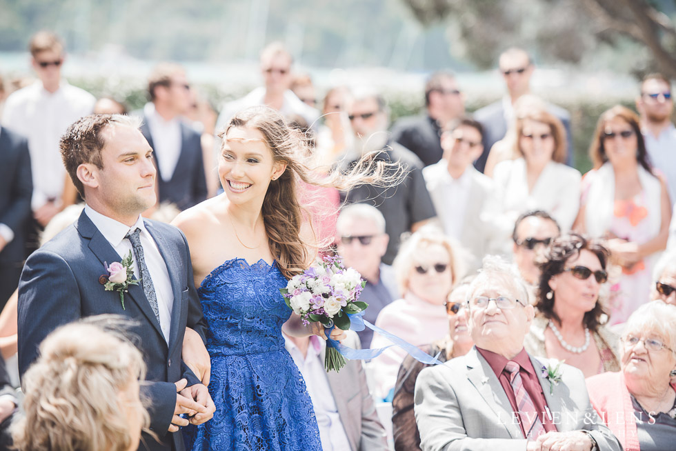 bridesmaid and groomsmen walking down aisle - The Duke of Marlborough Hotel - Russel wedding {Northland-New Zealand weddings photographer} Pompallier Mission Garden