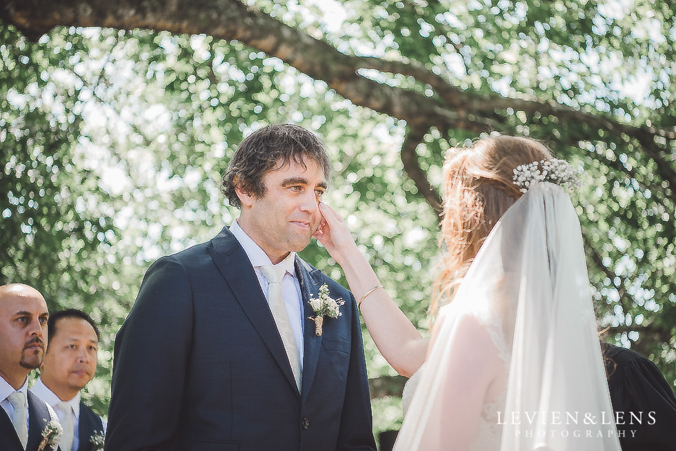 bride wiping grooms tears ceremony - Old Forest School Vintage Venue {Tauranga - Bay of Plenty wedding photographer}