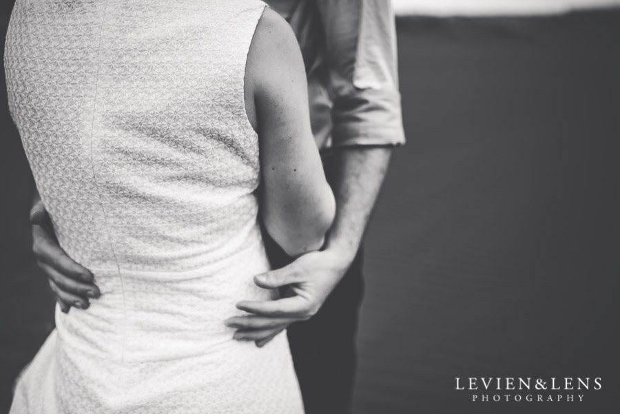 tender hug - Karekare Beach post-wedding | elopement photo shoot {Auckland NZ couples-weddings photographer}