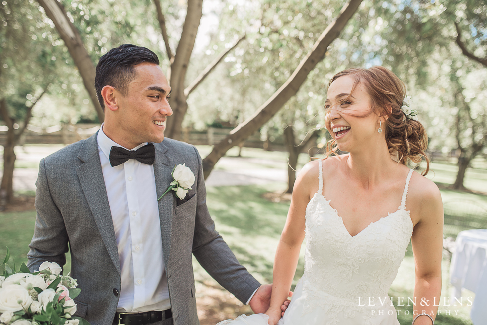 bride and groom laughing 