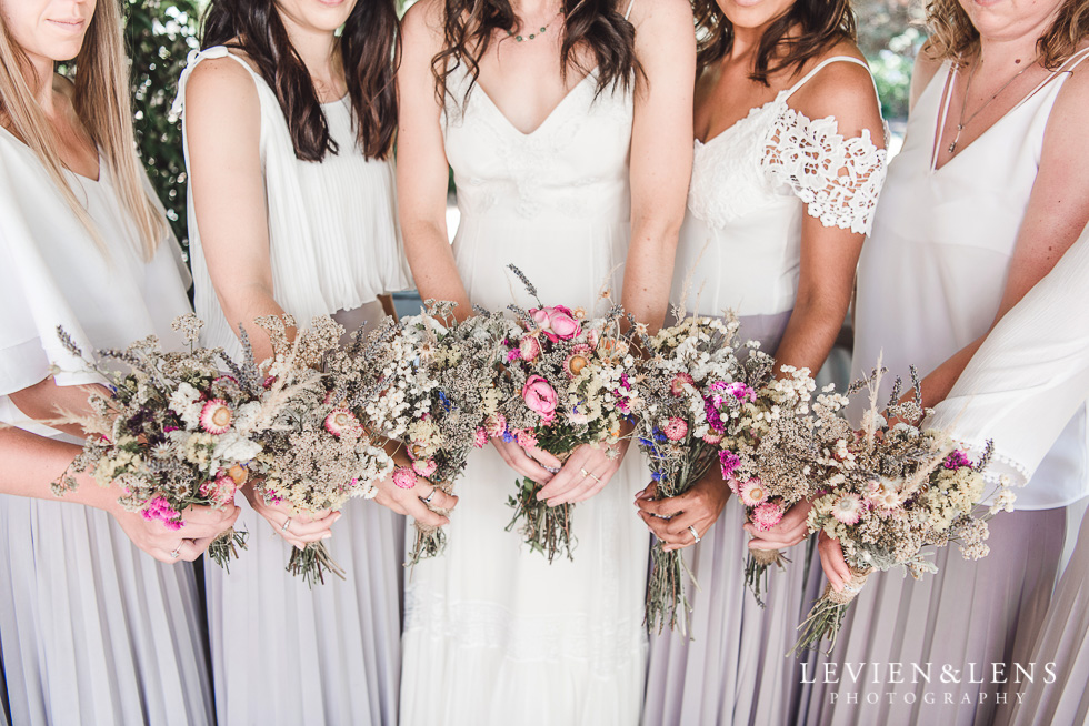 bride with bridesmaids and flowers