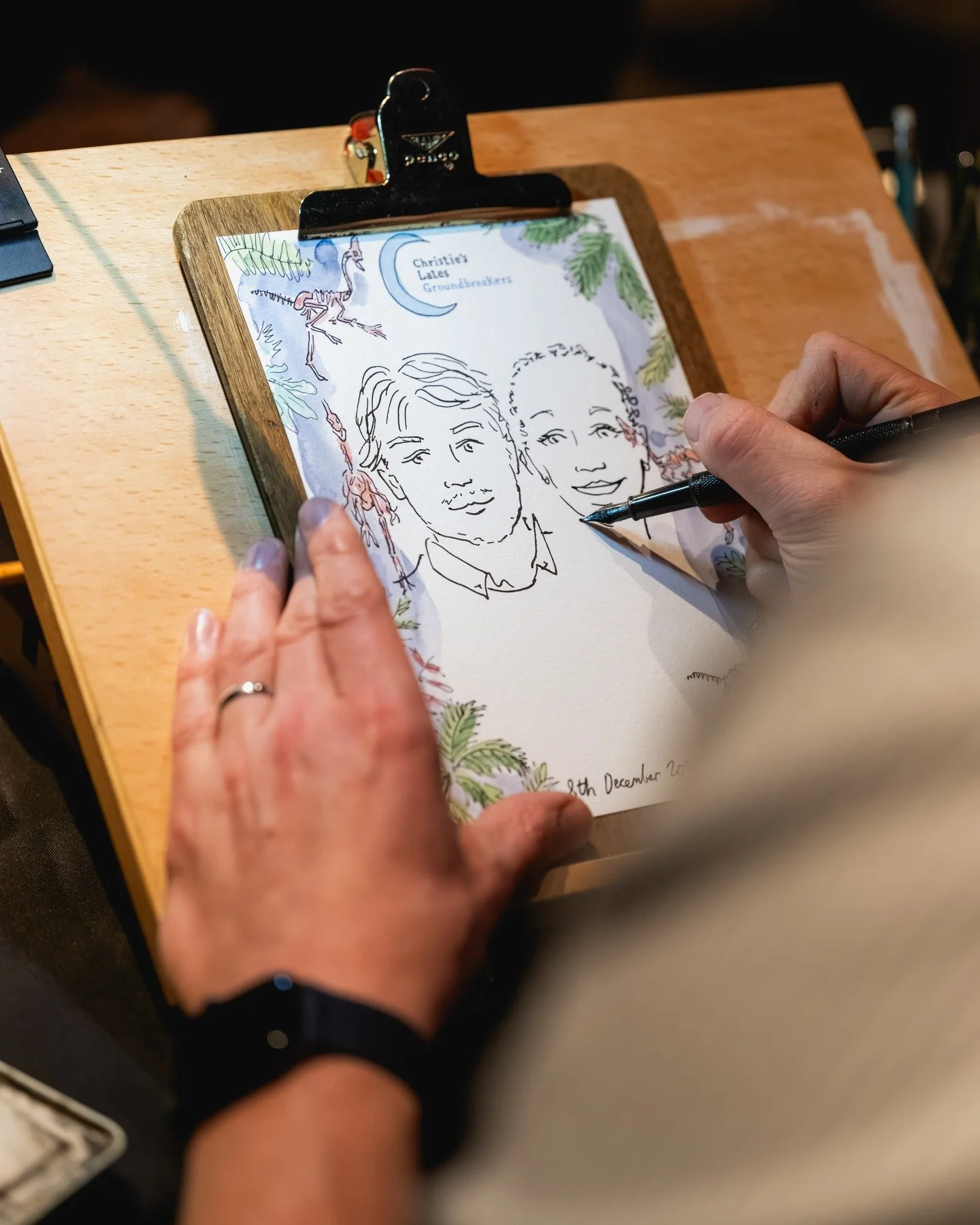 Monday evening at Christie's Lates Groundbreakers, where I drew live portraits of attendees alongside their amazing collection of items on display, I worked in the same room as a 68 million year old never seen before dinosaur! My portraits were all d