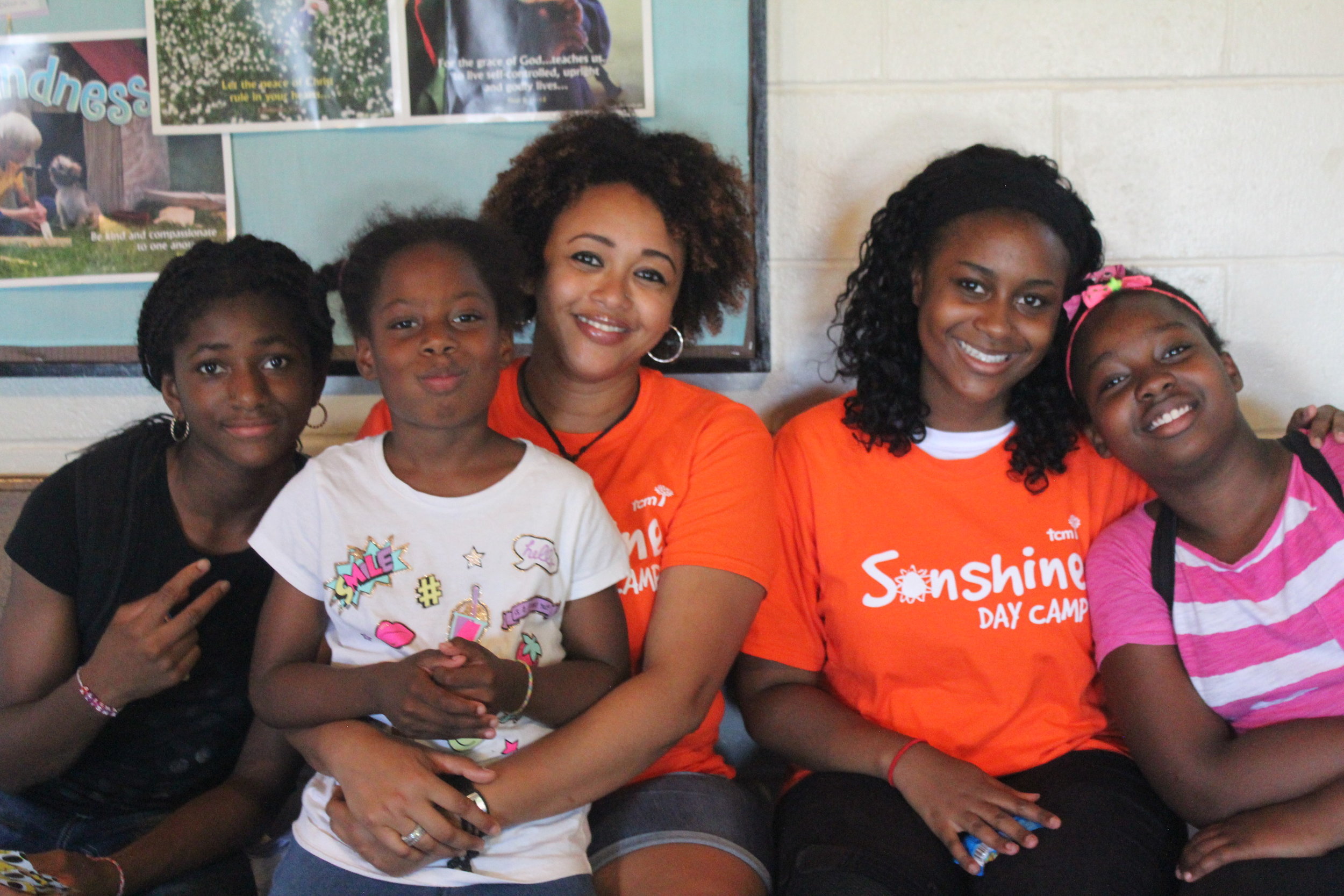Enniael (second from the right), with kids from Kingston-Galloway.