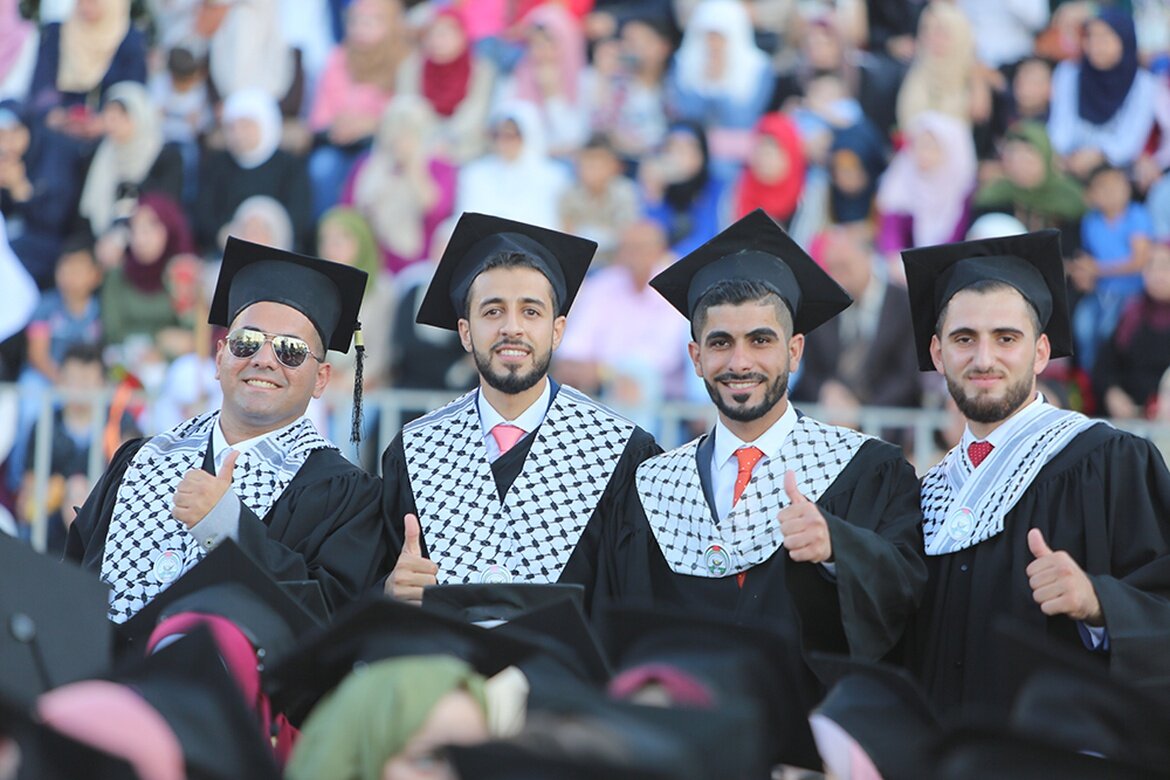  Graduates in Palestine wear stoles to celebrate their cultural heritage. Mariam’s school district told her the Palestinian stole did not meet the criteria for cultural adornment. (Credit: Al Najah University) 