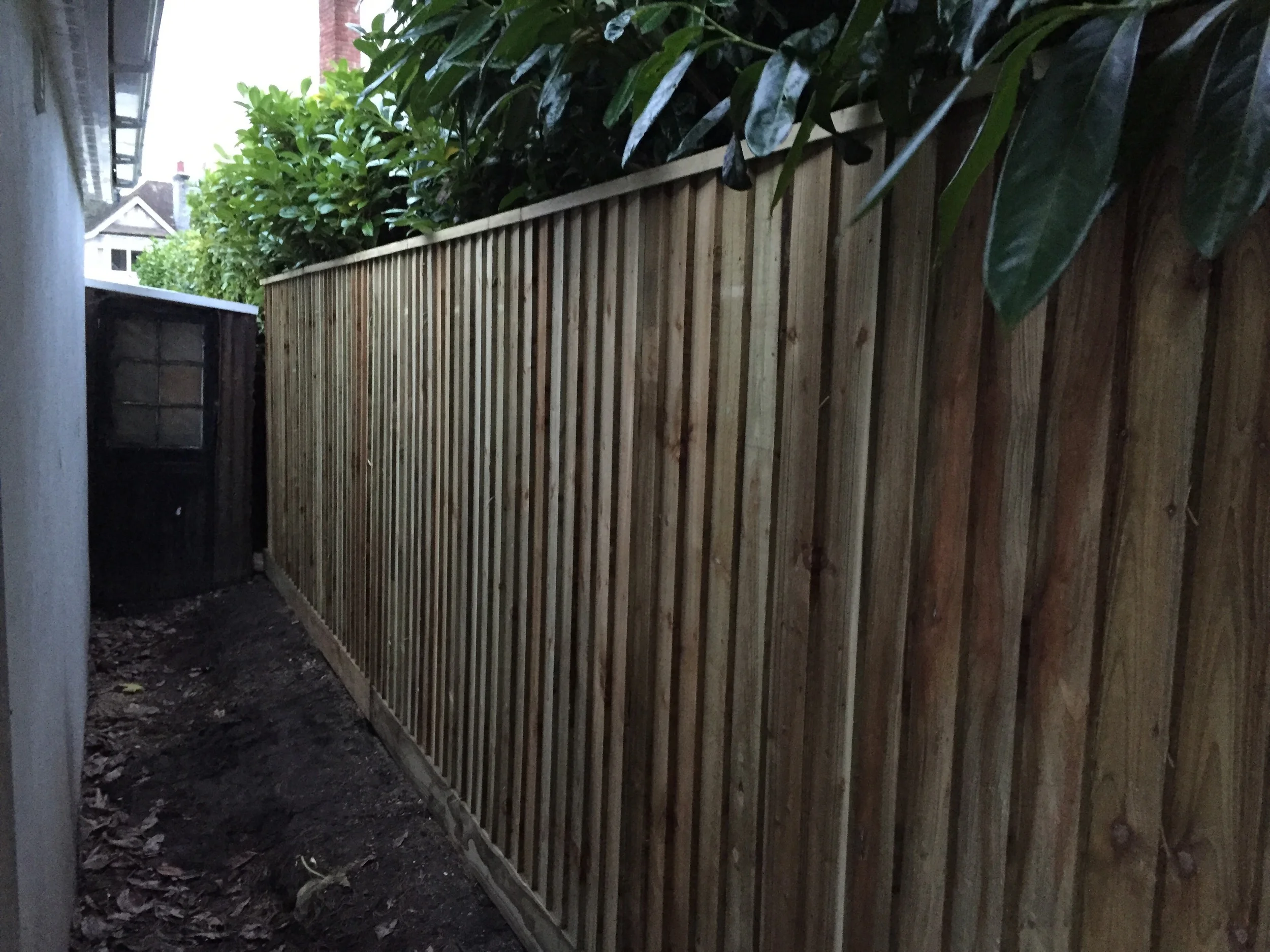 Feather edge boards and trenched capping have now been fitted to finish the fence.