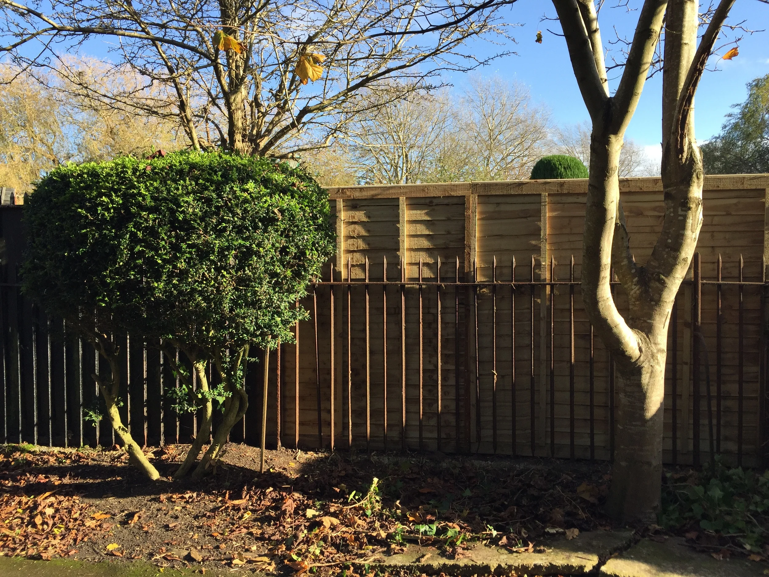 Panels were fitted behind metal railings, posts concreted behind so as to be concealed.