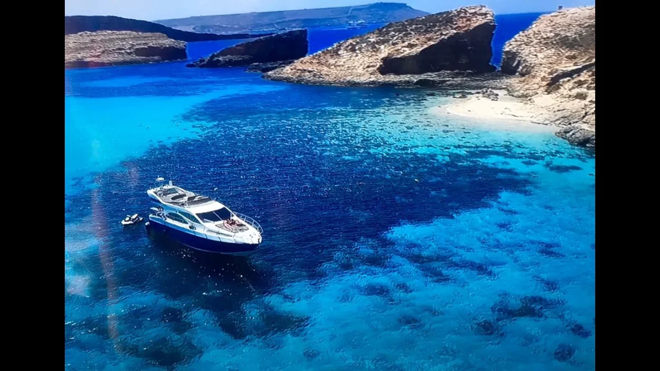 Picture: AZIMUT Malta Charter Club - AZIMUT 46 Flybridge at anchor in Blue Lagoon, Comino, Malta.