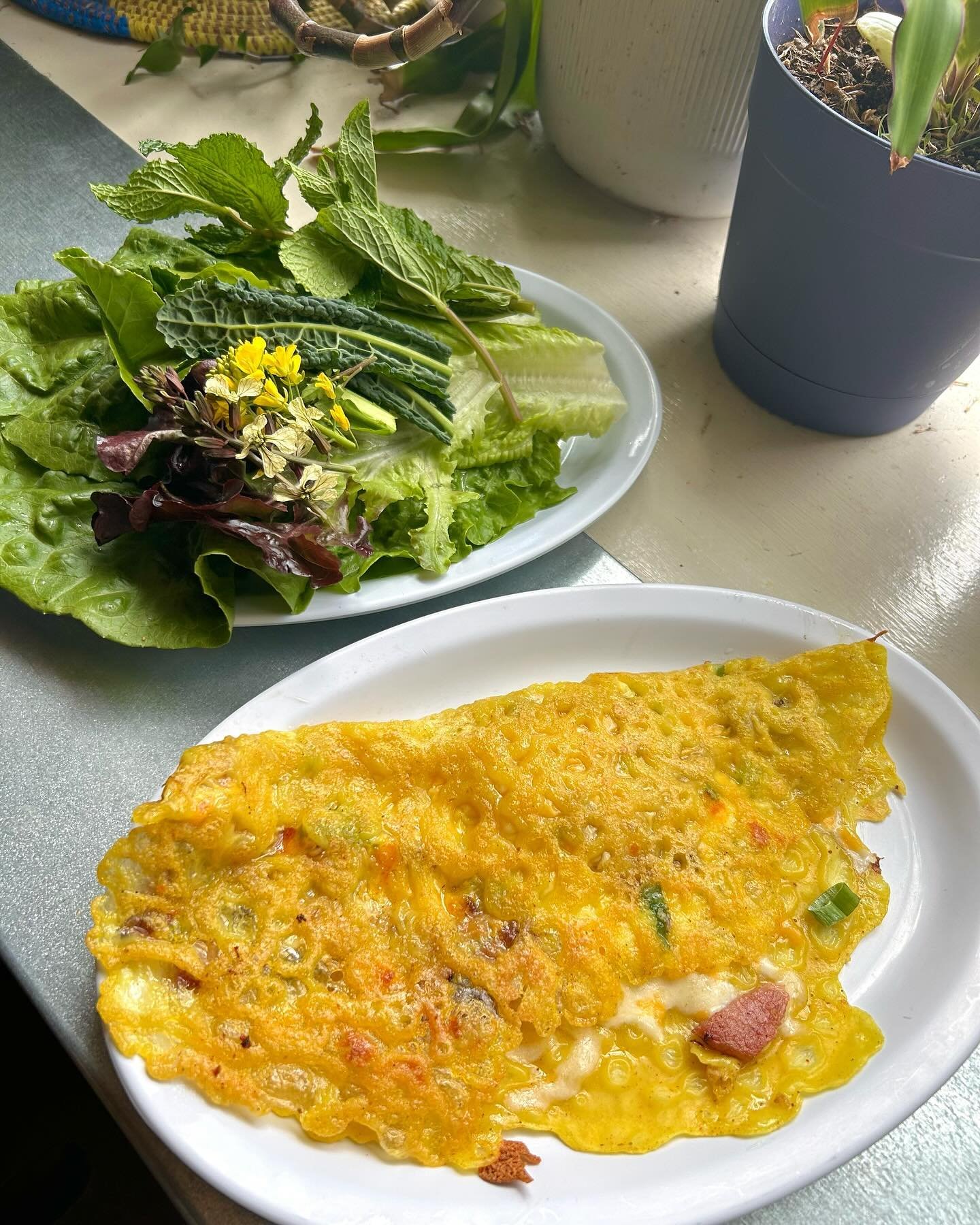 our breakfast b&aacute;nh x&egrave;o&hellip; think of it like a civil union between a bacon egg &amp; cheese and a classic b&aacute;nh x&egrave;o. or, a crispy fried rice flour &amp; coconut milk crepe stuffed with bacon, egg and cheese, and served w