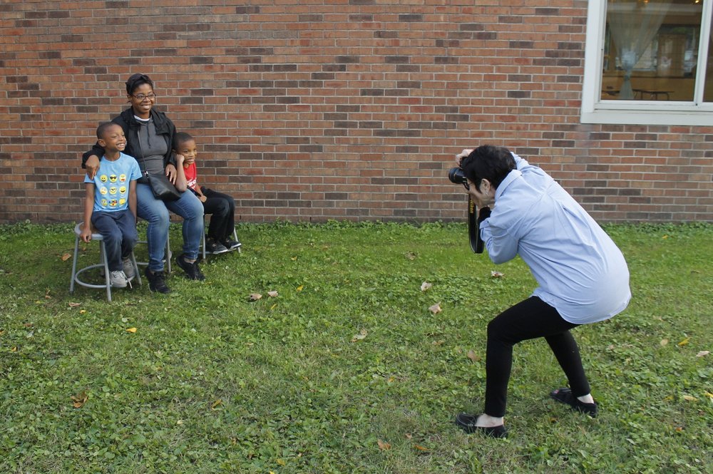 Peg taking family portraits at Fall Family Night - September 2018