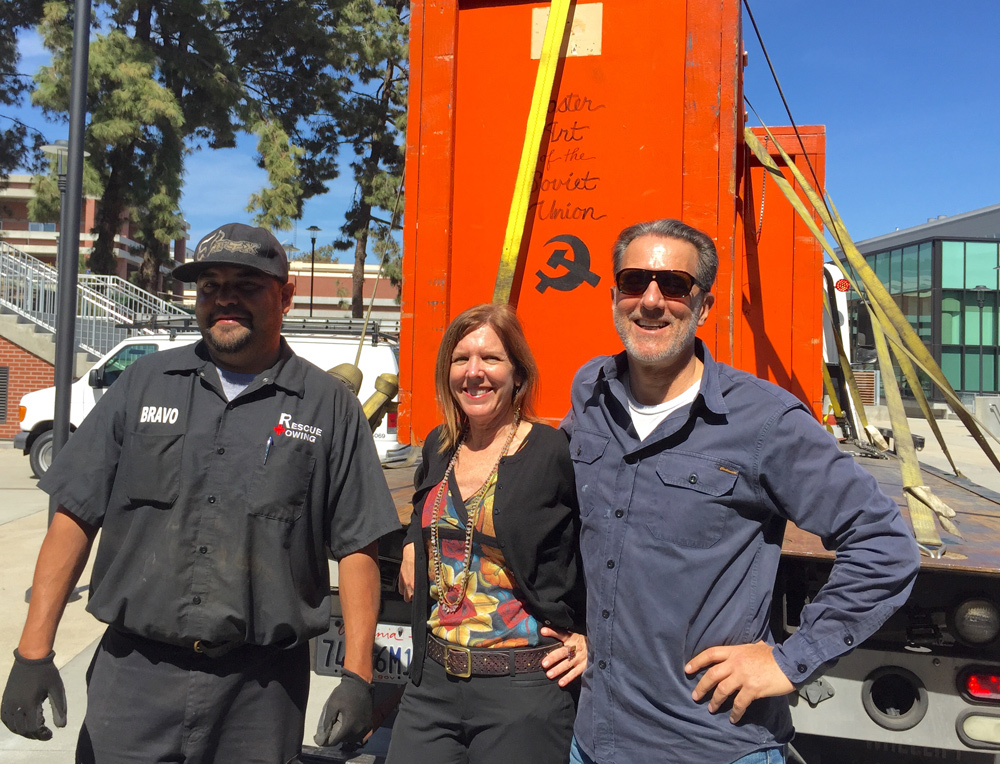 The arrival of the infamous orange show crates. Bravo, Candice Lopez and Ron Miriello