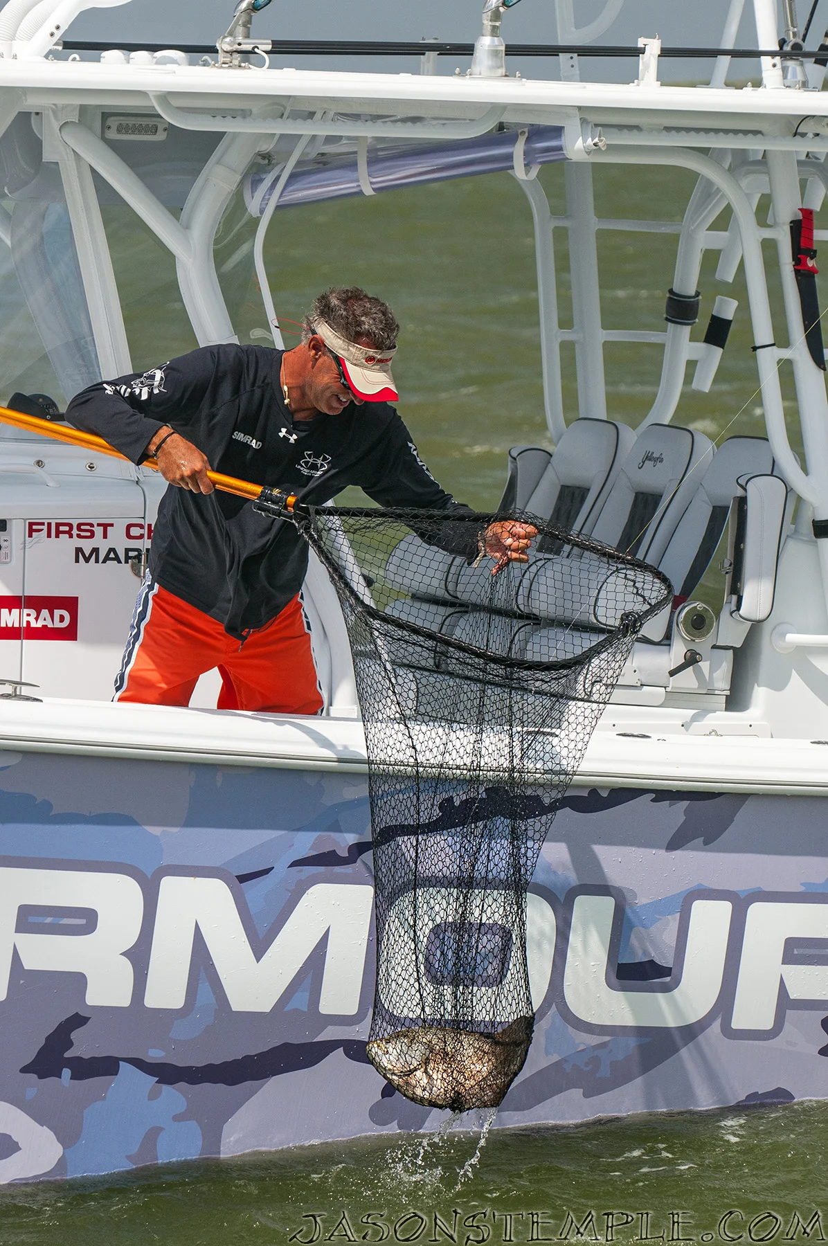 Scott Walker Nets A Beautiful Tripletail with the Frabill Power Stow Net