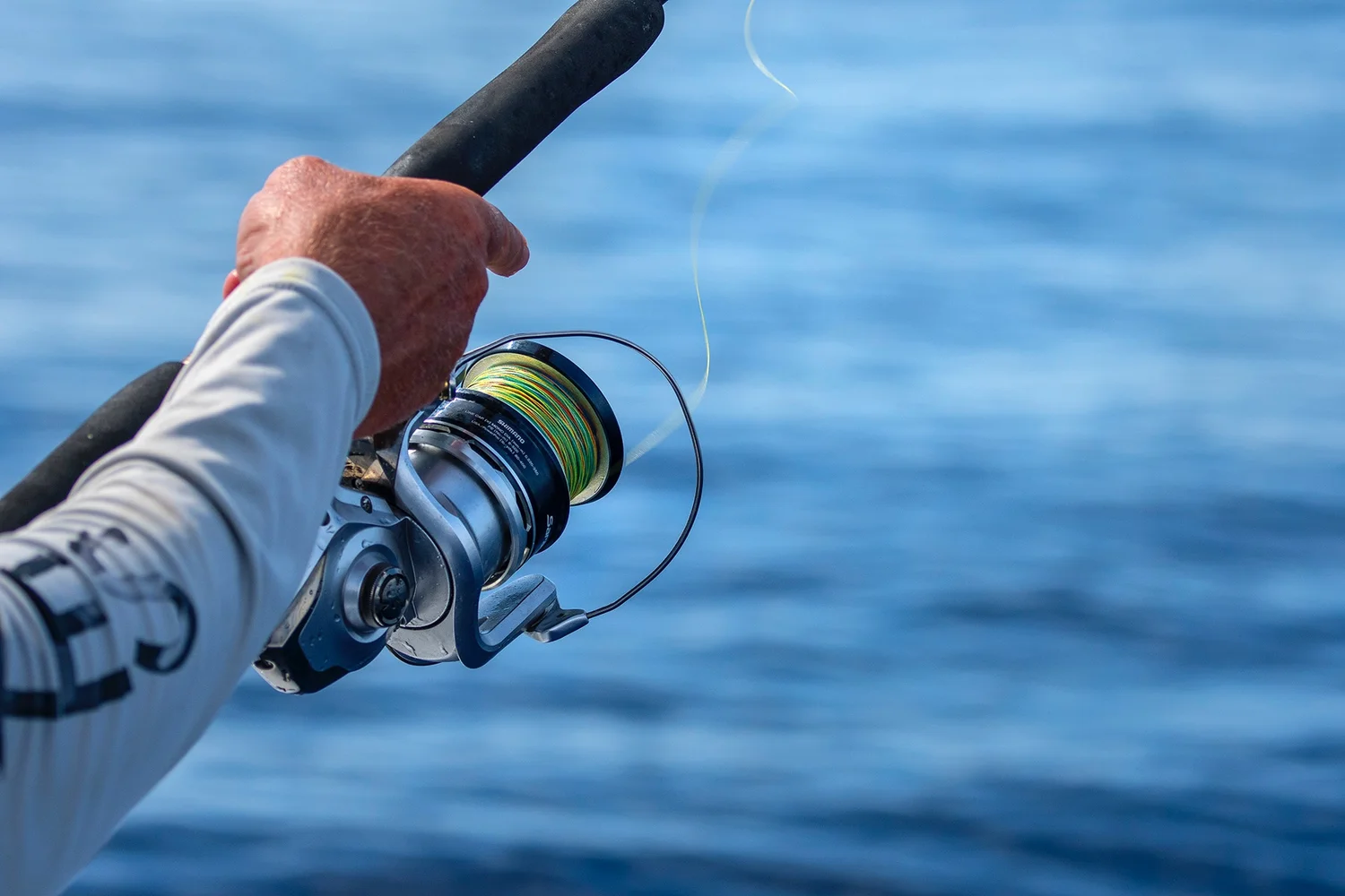How to Properly Spool a Spinning Reel with Braid  Into the Blue Fishing  Blog