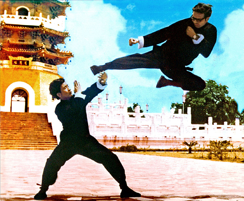 Senior Grandmaster Lee performing his classic flying sidekick with Li Kuo Wang in front of the Tsuen Ta Pagoda at Sun Moon Lake - Republic of China, 1972.