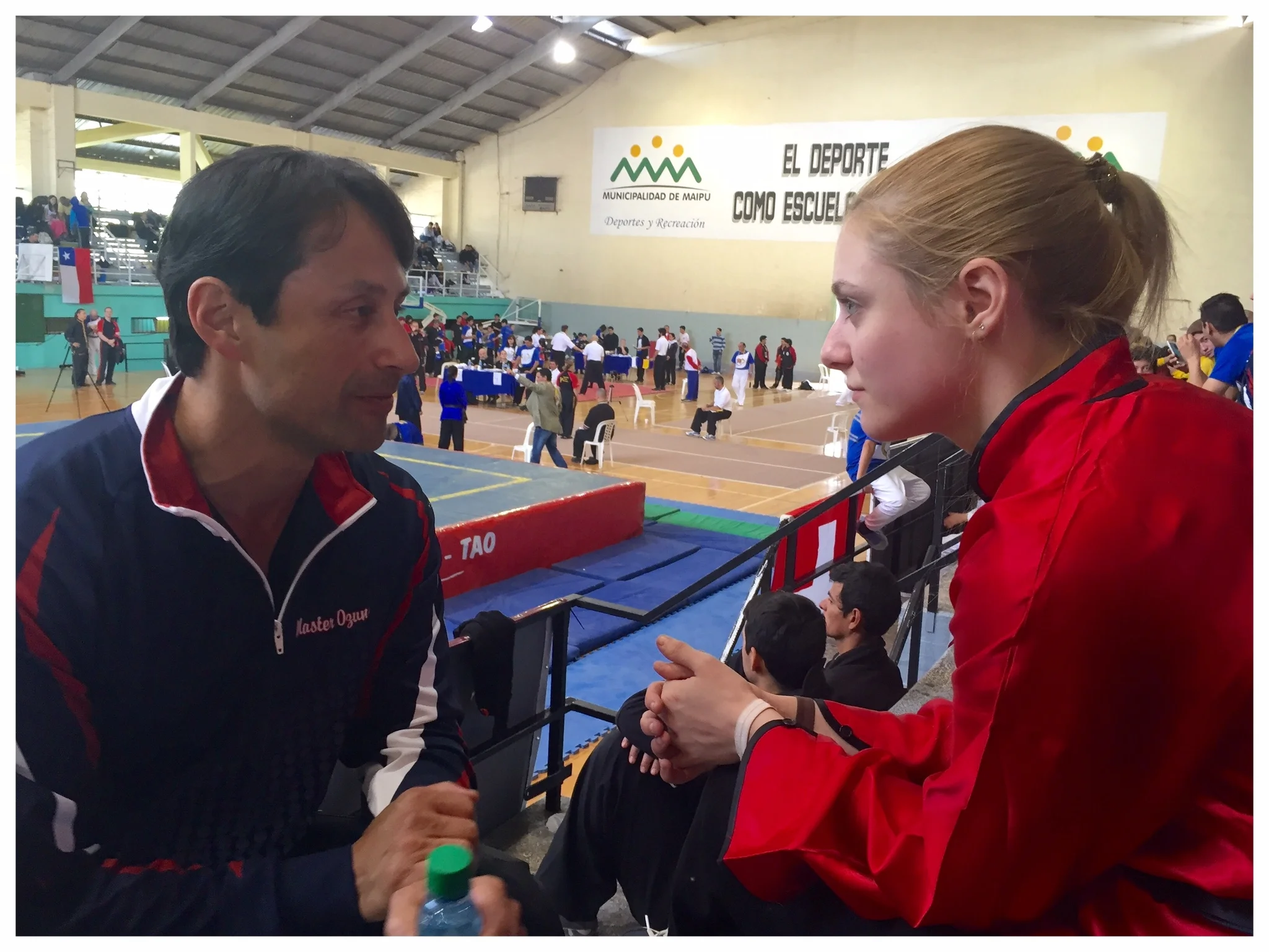 Master Ozuna coaches Katie Schmid between events at the 5th TWKSF Championship Tournament in Mendoza, Argentina