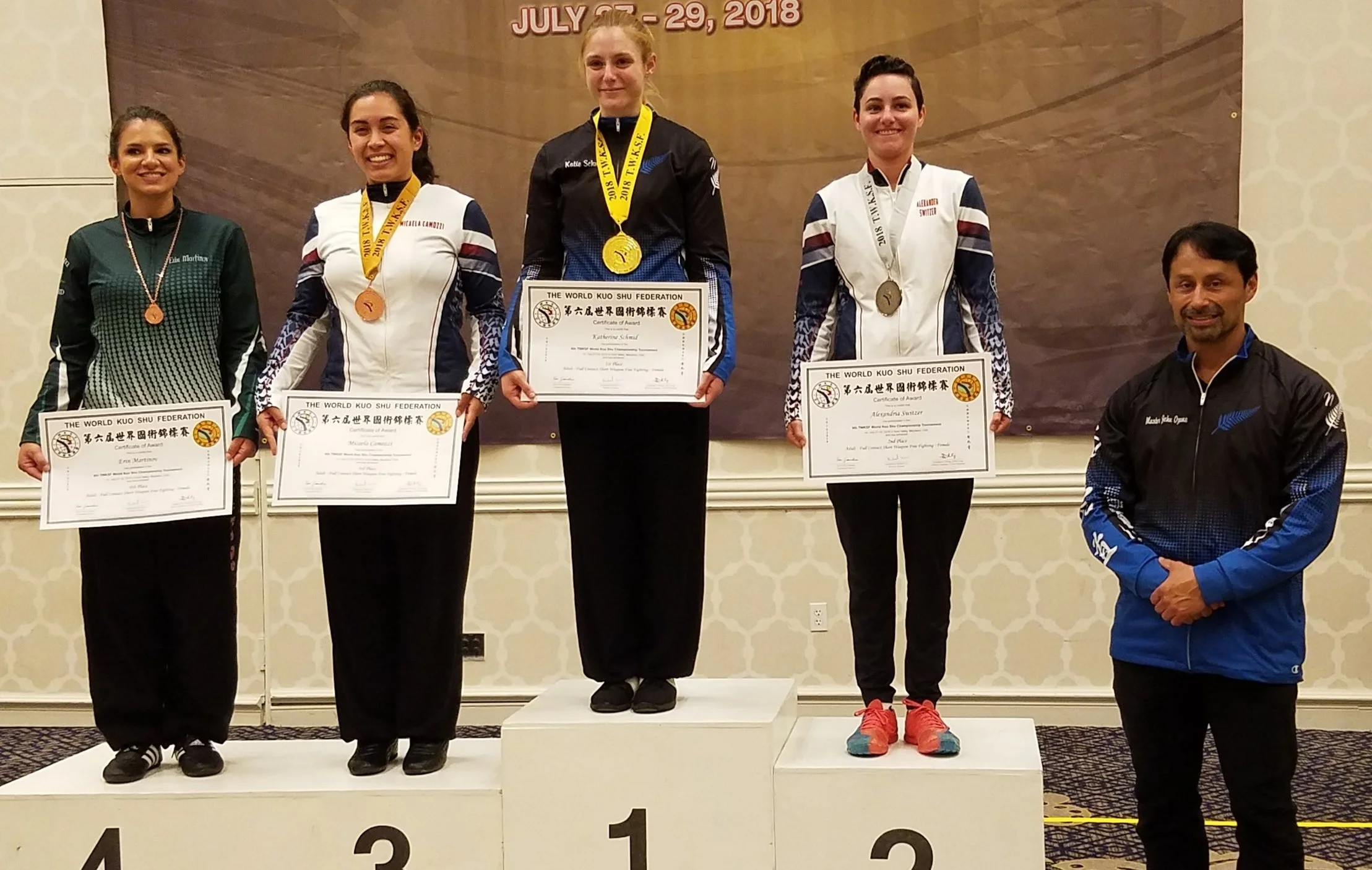 Katie Schmid receives her first place medal in Full Contact Short Weapons Fighting at the 6th TWKSF World Championships in the United States