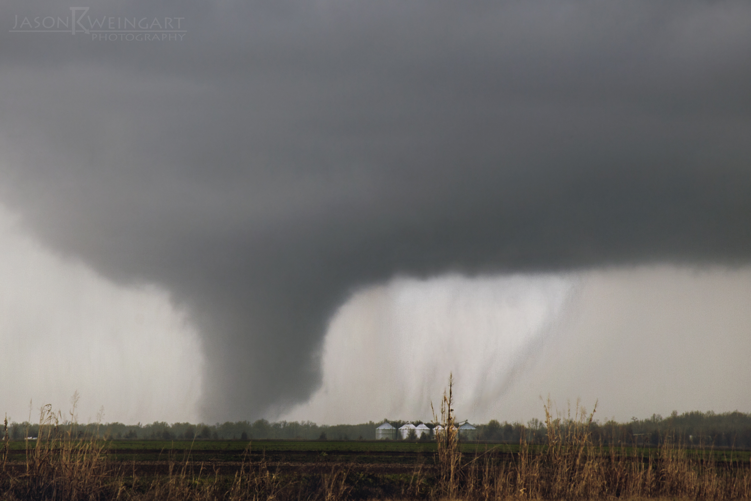 3:05pm CST. Two large tornadoes moving north of Shelby, Mississippi. Contrast enhanced to show both tornadoes. 