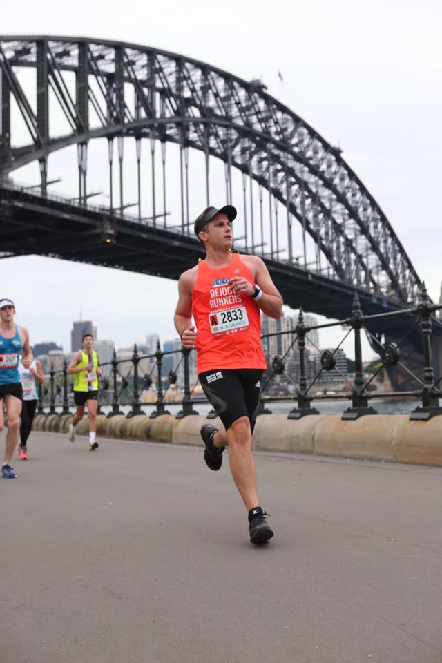 Tommy Callachor - half marathon pb - focused on pace and on the finish line 2k away! 
