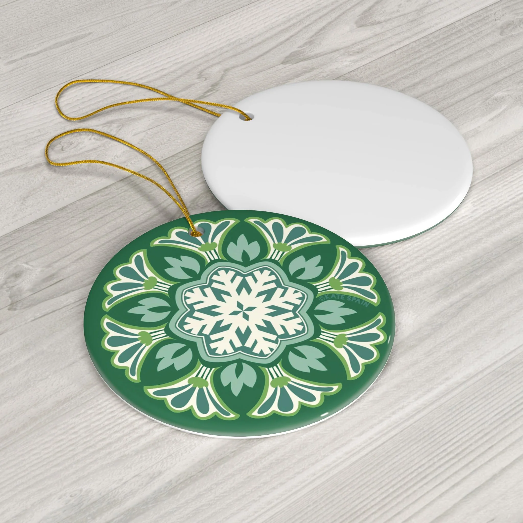 decorative snowflake on green background holiday christmas winter ornament 3 inch round porcelain ceramic front and back