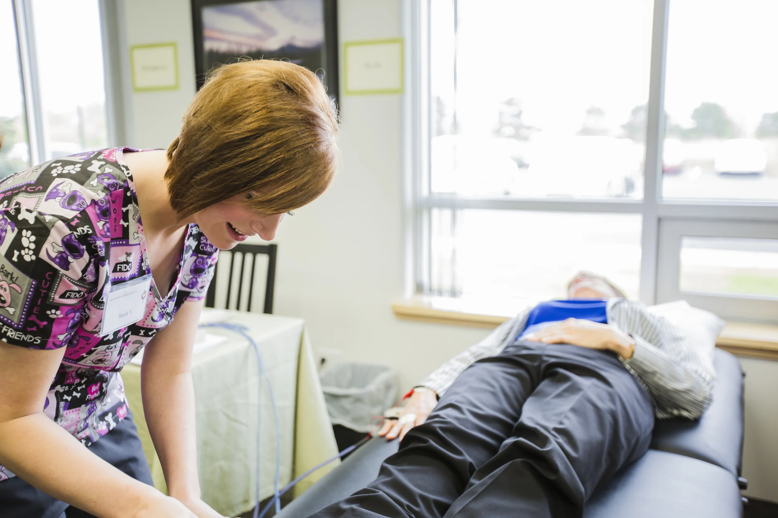 Sarah performs a free BIA on an Open House attendee at the 2015 Open House.