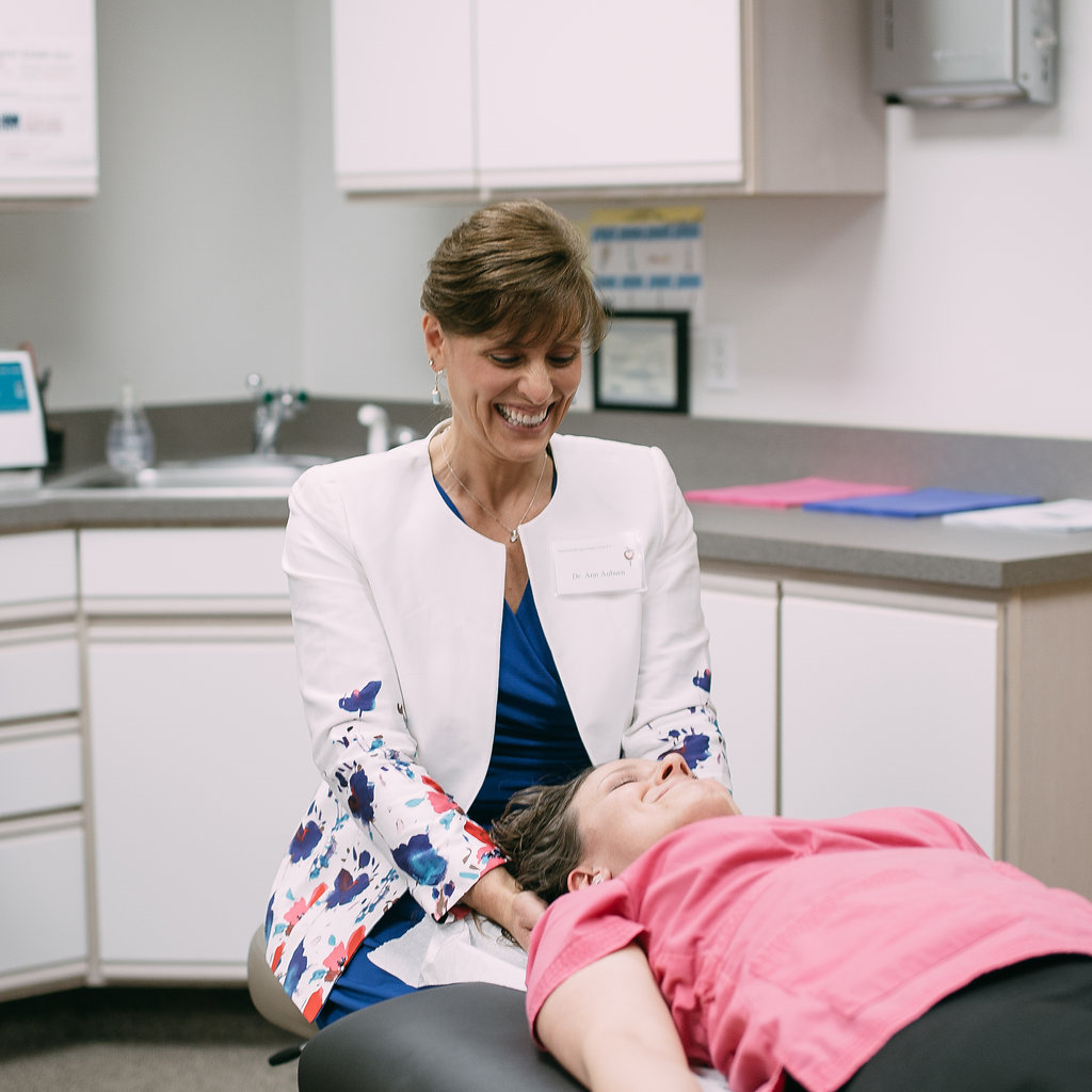 Dr. Auburn performs craniosacral therapy on a staff member at the 2016 Annual Open House. Photo Credit: Chantal Elise Photography