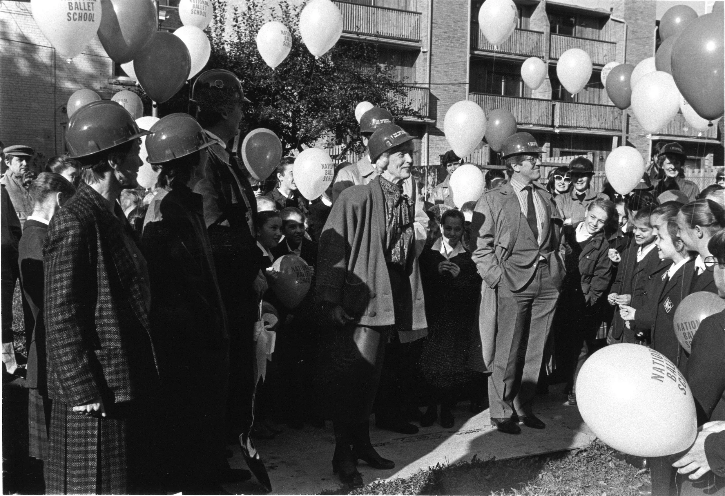 Betty Oliphant, complete with hard hat, kicks off construction on the R.A. Laidlaw Centre alongside Bill Poole, David Silcox, Mavis Staines and Mora Oxley in 1986.