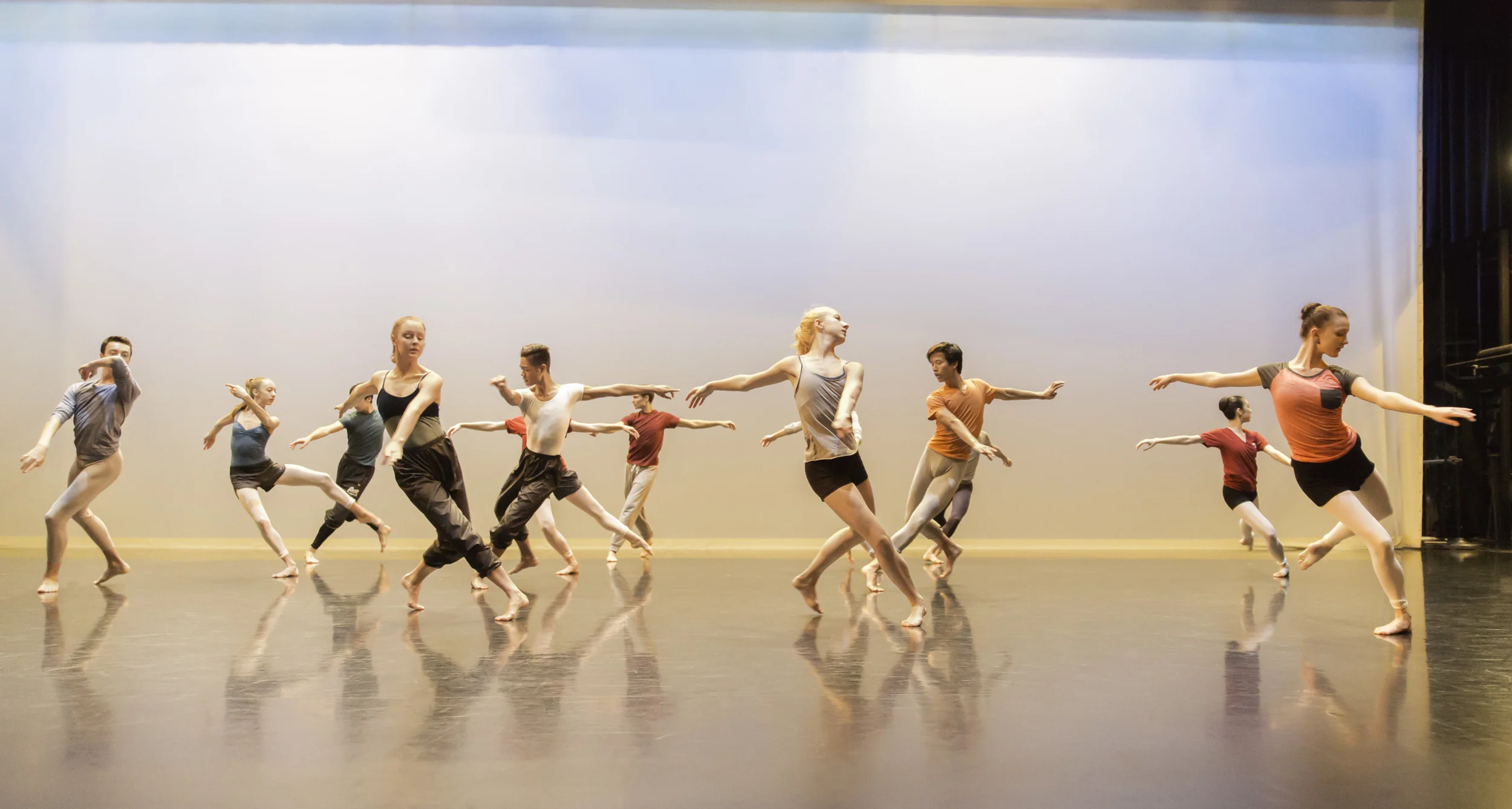 Students rehearse a contemporary dance piece on stage at the Betty Oliphant Theatre. Professional companies increasingly look for dancers who can embrace contemporary choreography just as much as classical choreography.