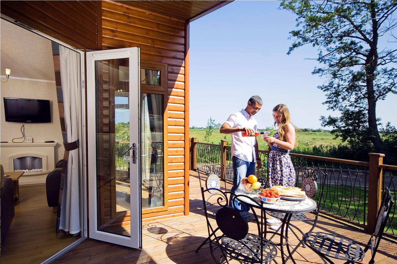 Waveney-River-Centre-lodge-balcony-with-guests.jpg