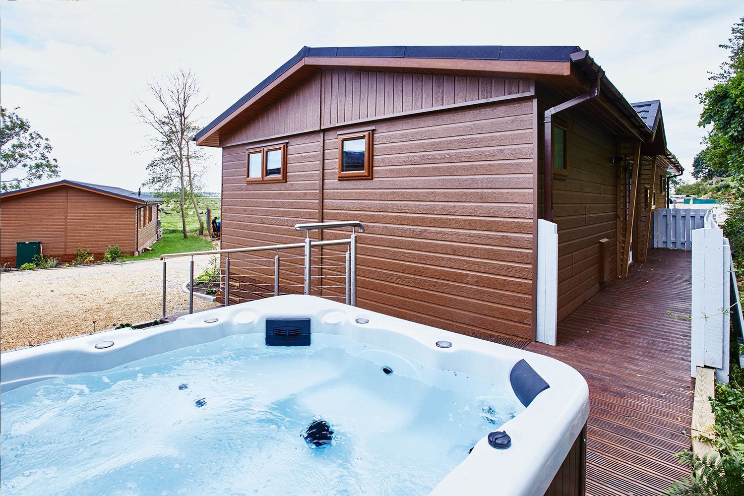 Waveney-River-Centre-lodge-with-hot-tub.jpg