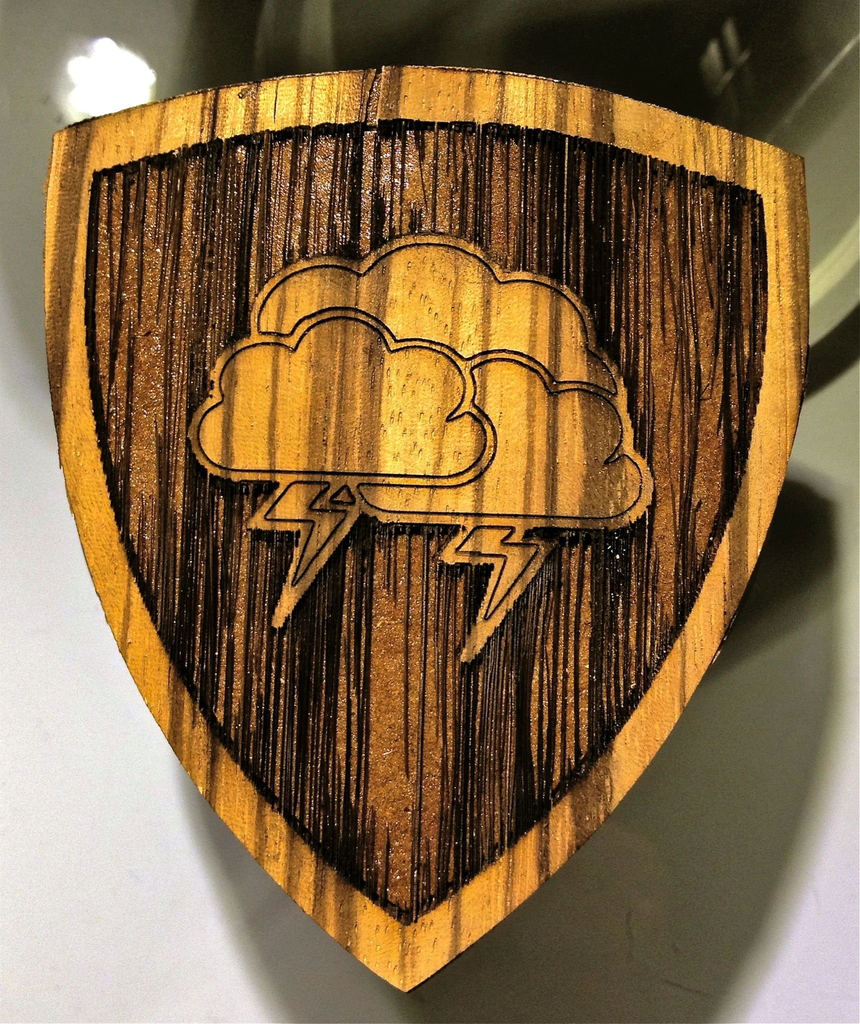 This wooden talisman offers protection from inclement weather.