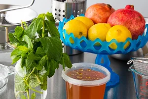 Pomegranates, Lemons, Honey and Mint come together in this Winter Lemonade.