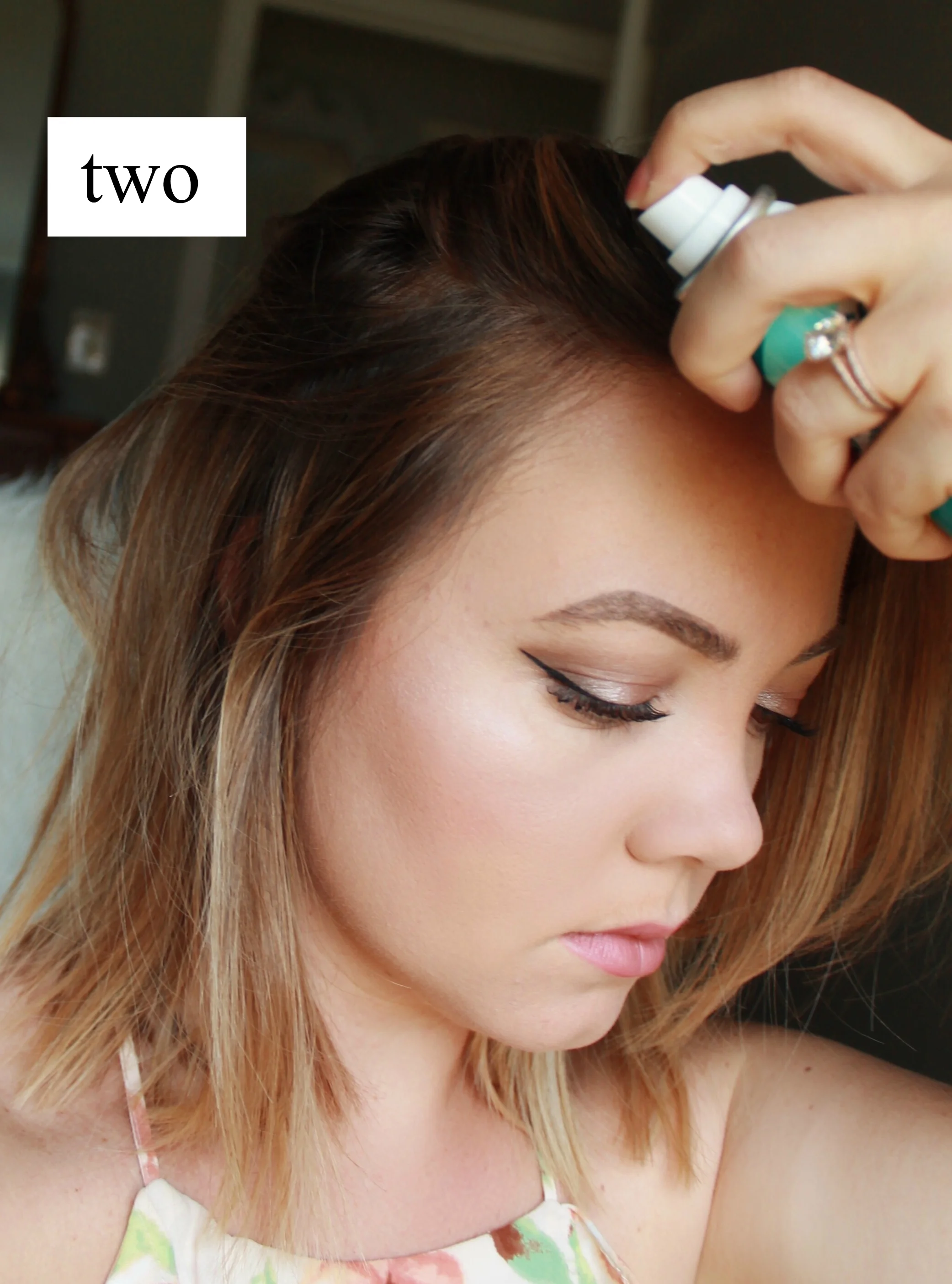 I first spray dry shampoo in my roots to add some texture and remove any oil. 