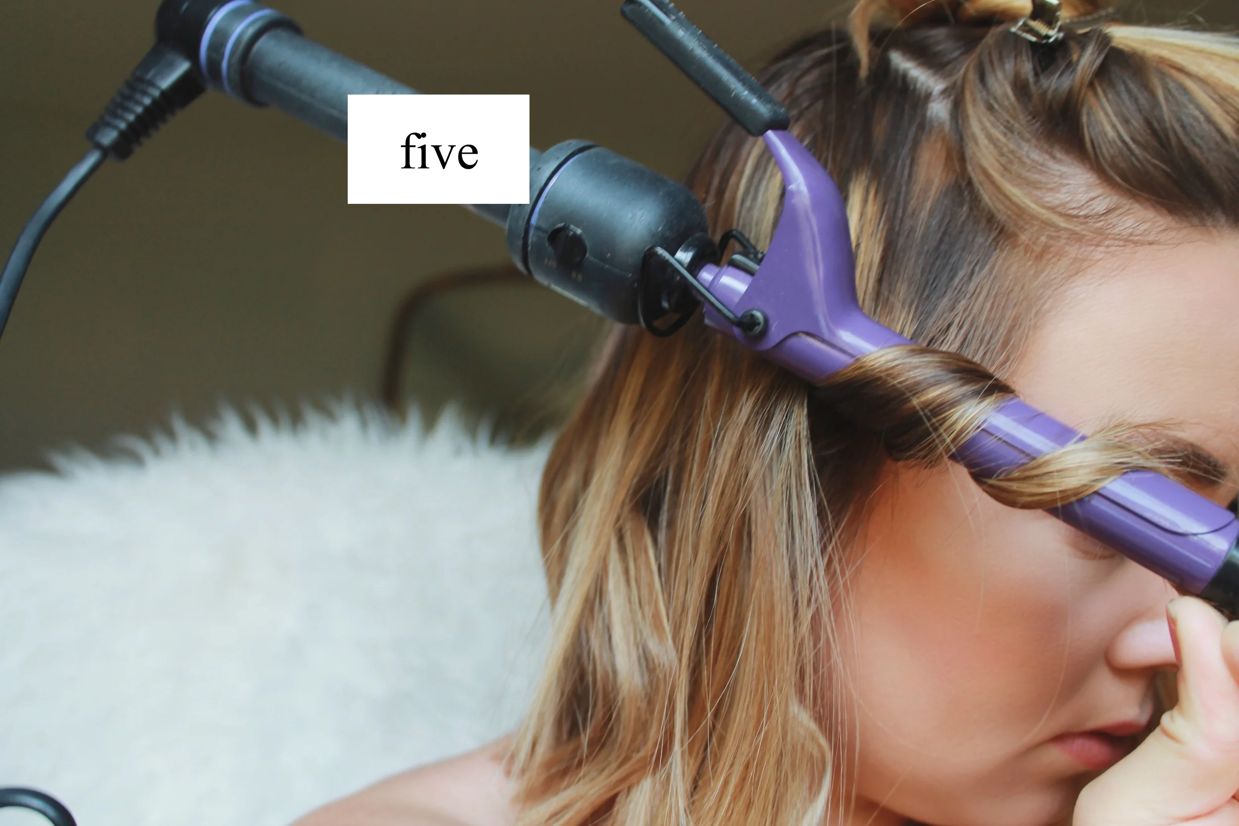 Wrap your hair around the wand leaving the end out, we want that part to remain straight. I vary in the amount of hair for each curl because we want it to appear messy! 