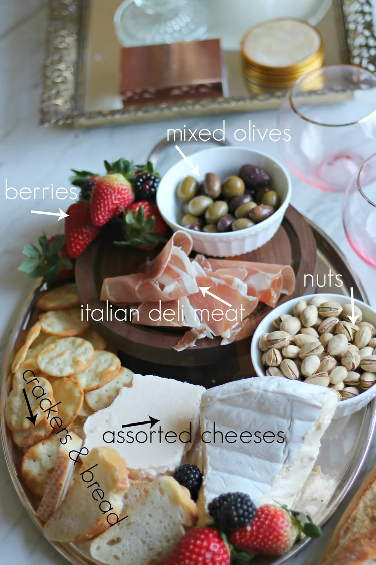 These are the basics every good cheese platter should have. Our absolute favorite cheeses are the Unexpected Cheddar from Trader Joe's and their brie cheese. 