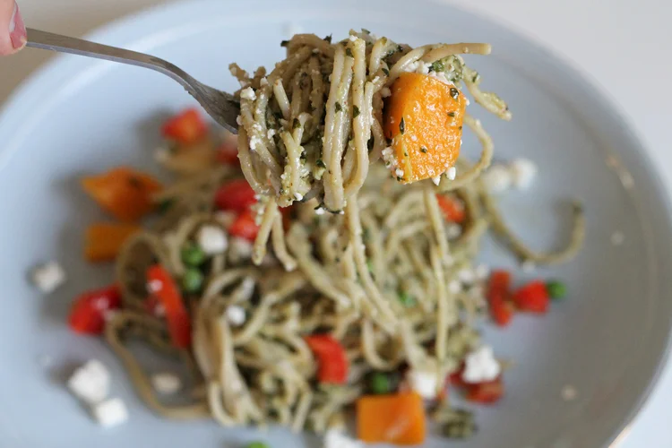 For Pesto: 1/4 cup walnuts 1/4 cup pignoli (pine nuts) 3 tablespoons chopped garlic (9 cloves) 5 cups organic fresh basil leaves, packed 1 teaspoon kosher salt 1 teaspoon freshly ground black pepper 1 1/2 cups good olive oil 1 cup freshly grated parmesan Vegetables: 1 red organic bell pepper 2 bag of Trader Joe's butternut squash 1 cup of organic peas 1 organic white onion Some feta for topping.