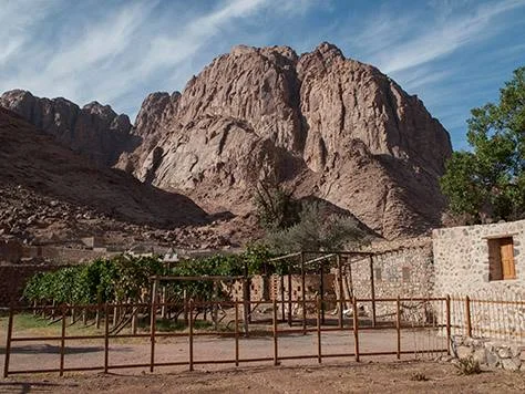 The barren rock of Sinai rising above the Chapel of the Nativity of the Theotokos
