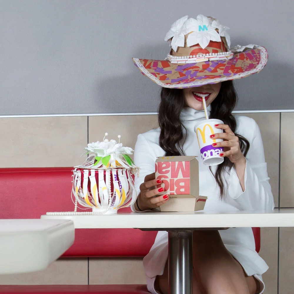 Who they kidding? One bite of that burger and that girl would't fit in that size 0 anymore...