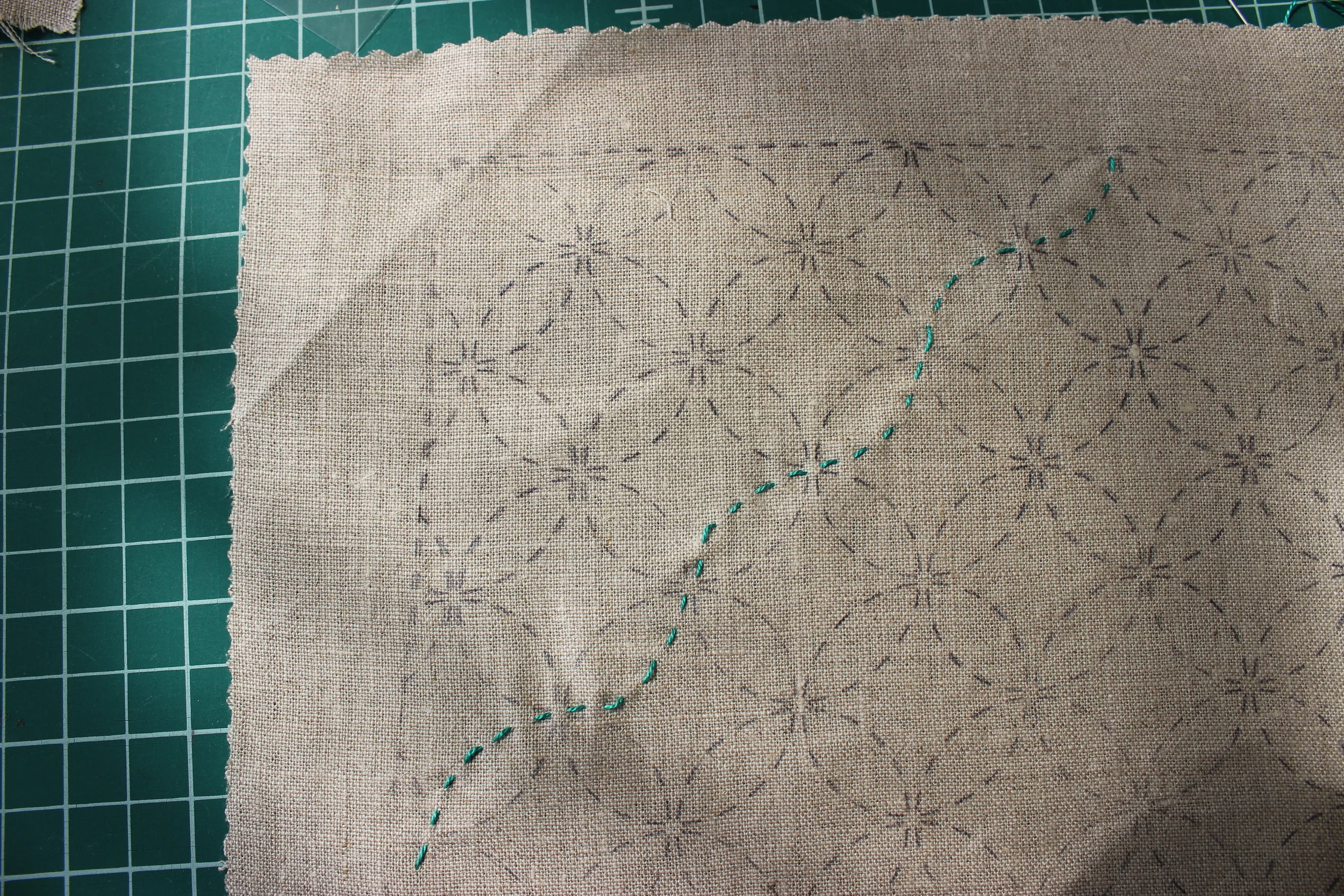 Here's a photo of our hoops and loops pattern in progress. This pattern was stamped on natural linen fabric, but we find light-colored cotton takes the ink much more easily.