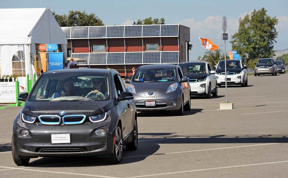 Solar Decathlon EV Parade! Our BMW i3 is the first white one with Avery Sandler and Taylor Kelley.