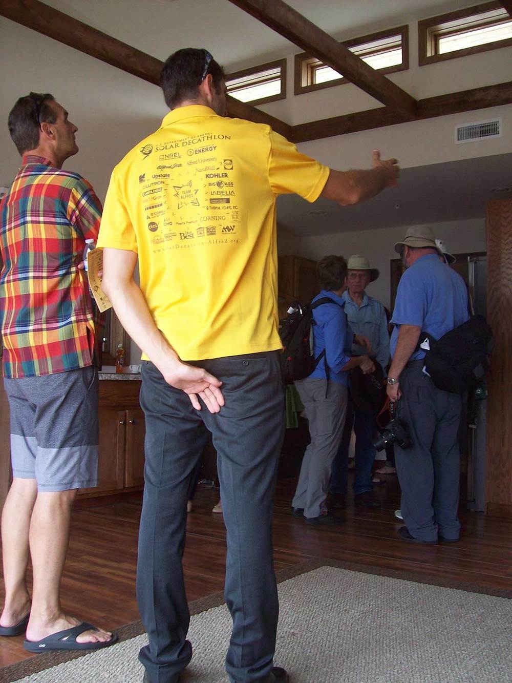Avery Sandler showing guest an aspect of the interior.