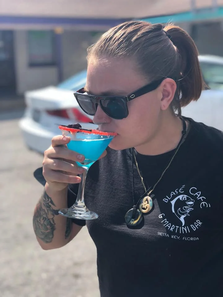 Front of House Manager Macy drinking the festive 4th Of July Martini Of The Day 2018!